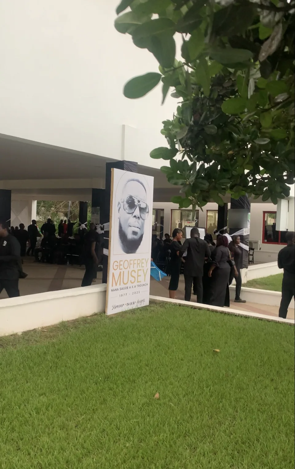 Family and guests gathered near the Geoffrey Musey memorial display in Lashibi